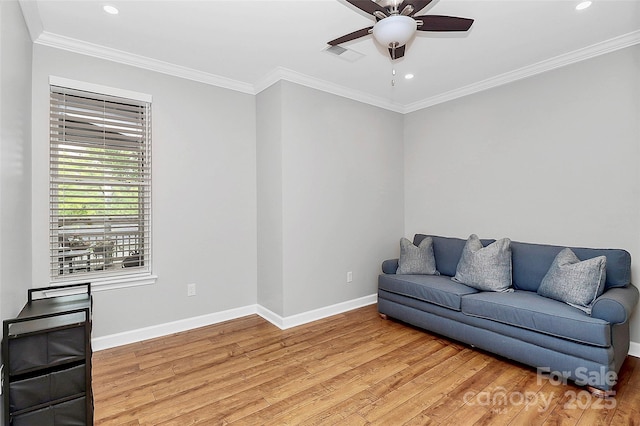 921 NE Dr, Davidson, NC 28036 - living room featuring light wood-type flooring, a ceiling fan, recessed lighting, and ornamental molding