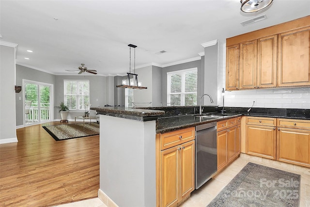 921 NE Dr, Davidson, NC 28036 - kitchen with stainless steel dishwasher, ornamental molding, plenty of natural light, a peninsula, and ceiling fan