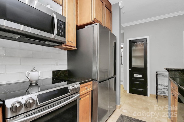 921 NE Dr, Davidson, NC 28036 - kitchen featuring appliances with stainless steel finishes, ornamental molding, tasteful backsplash, brown cabinets, and dark stone countertops