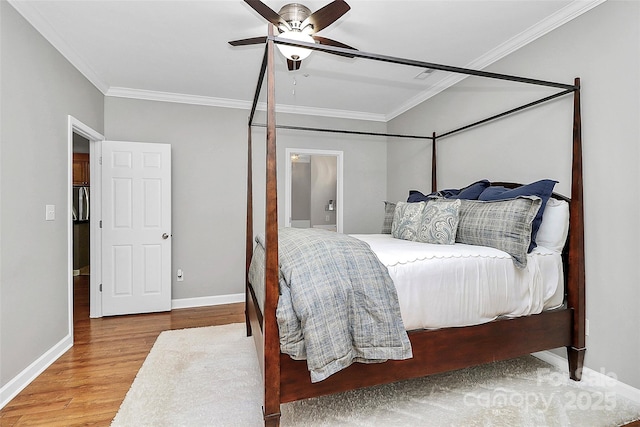 921 NE Dr, Davidson, NC 28036 - bedroom with wood finished floors, ornamental molding, and ceiling fan