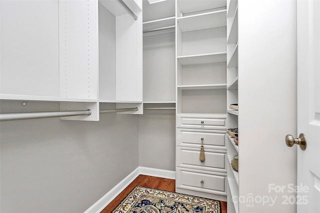 921 NE Dr, Davidson, NC 28036 - walk in closet with dark wood finished floors