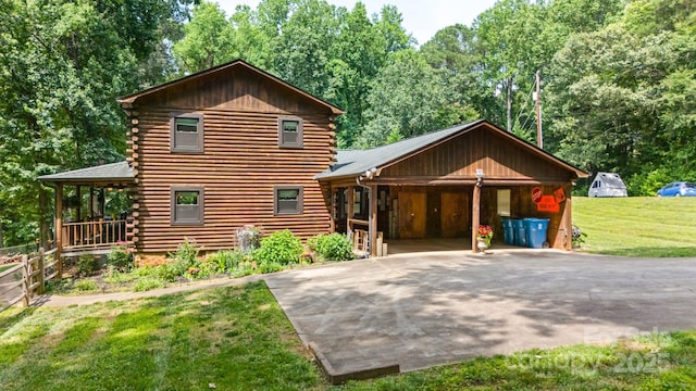 6836 Summer Hill Dr, Denver, NC 28037 - log-style house with log siding, driveway, and a garage