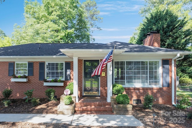 4526 Longwood Dr, Charlotte, NC 28209 - view of front of home featuring brick siding, a chimney, and a shingled roof