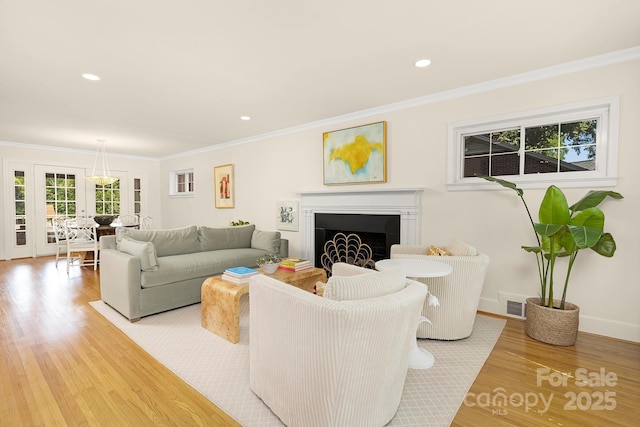 4526 Longwood Dr, Charlotte, NC 28209 - living area featuring light wood-style flooring, a fireplace, crown molding, and recessed lighting