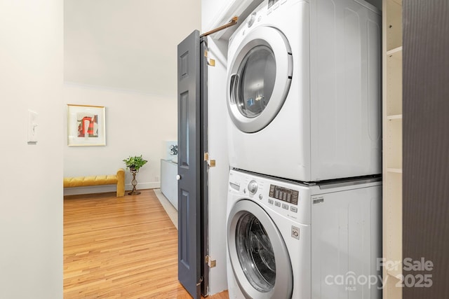 4526 Longwood Dr, Charlotte, NC 28209 - laundry area featuring stacked washing machine and dryer and light wood-style floors
