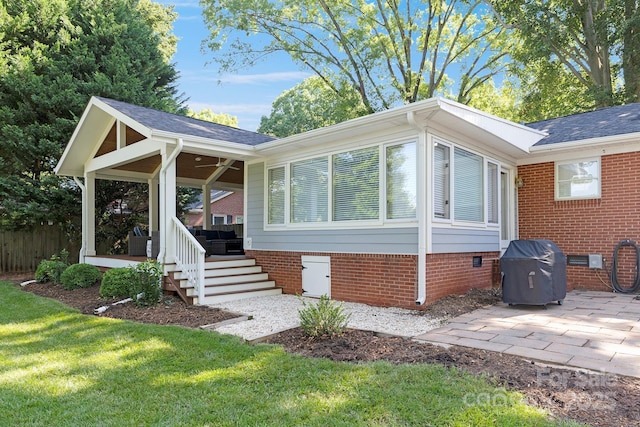 4526 Longwood Dr, Charlotte, NC 28209 - view of property exterior featuring crawl space, a lawn, a patio area, a shingled roof, and ceiling fan