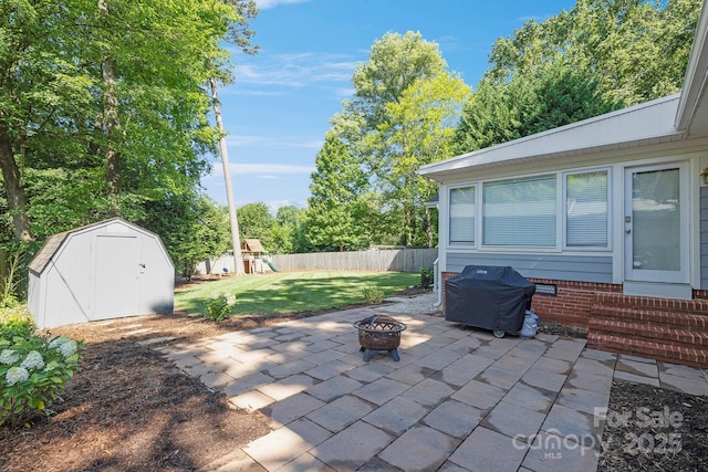 4526 Longwood Dr, Charlotte, NC 28209 - view of patio with a fire pit, a storage unit, a playground, a grill, and entry steps