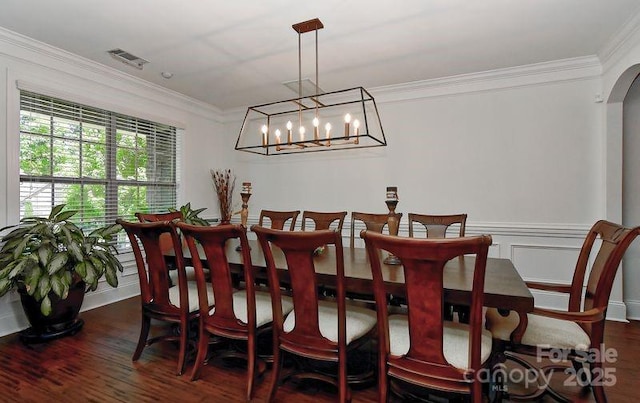3913 Widgeon Way, Waxhaw, NC 28173 - dining room featuring dark wood-style floors, ornamental molding, arched walkways, and a chandelier