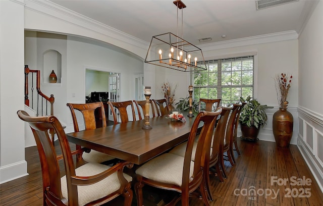 3913 Widgeon Way, Waxhaw, NC 28173 - dining area featuring a chandelier, wood-type flooring, ornamental molding, wainscoting, and stairs