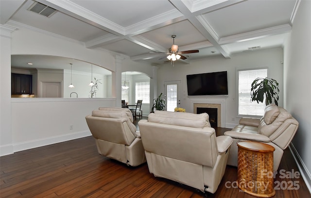 3913 Widgeon Way, Waxhaw, NC 28173 - living room with arched walkways, dark wood finished floors, beam ceiling, coffered ceiling, and healthy amount of natural light