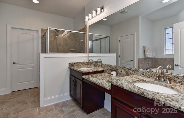 3913 Widgeon Way, Waxhaw, NC 28173 - bathroom featuring double vanity, a stall shower, and recessed lighting