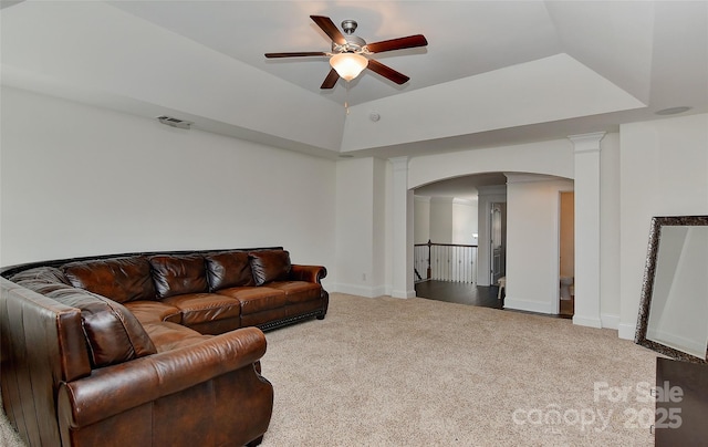 3913 Widgeon Way, Waxhaw, NC 28173 - living area with arched walkways, a ceiling fan, carpet, a raised ceiling, and ornate columns