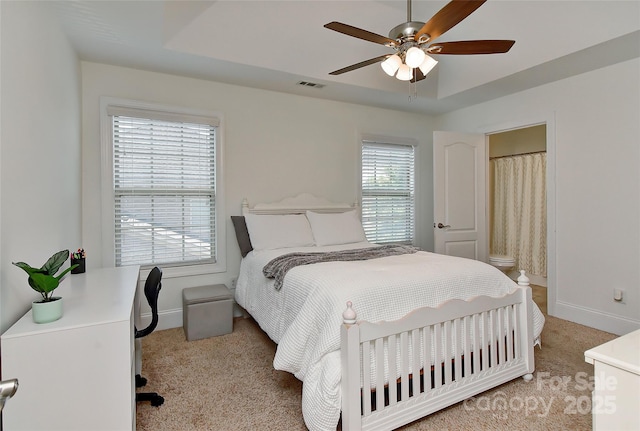 3913 Widgeon Way, Waxhaw, NC 28173 - bedroom with light colored carpet, a raised ceiling, and ceiling fan