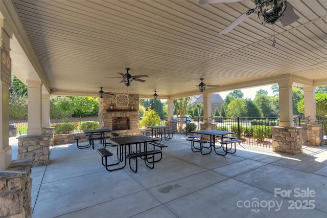 3913 Widgeon Way, Waxhaw, NC 28173 - view of patio / terrace featuring an outdoor stone fireplace and a ceiling fan