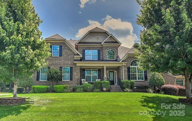 3913 Widgeon Way, Waxhaw, NC 28173 - craftsman house with brick siding and a front lawn