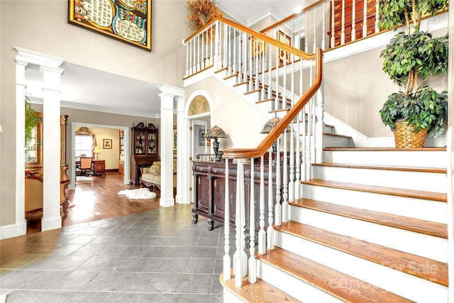 1933 Tara Trl, Lancaster, SC 29720 - stairs featuring decorative columns, crown molding, and a high ceiling
