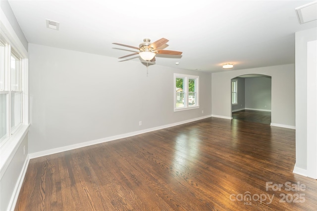 1208 Martin Luther King Ave, Kannapolis, NC 28083 - unfurnished room with arched walkways, ceiling fan, and dark wood-style floors