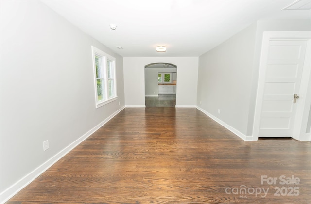 1208 Martin Luther King Ave, Kannapolis, NC 28083 - spare room featuring arched walkways and wood finished floors
