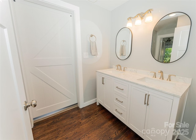 1208 Martin Luther King Ave, Kannapolis, NC 28083 - full bathroom featuring double vanity and wood finished floors
