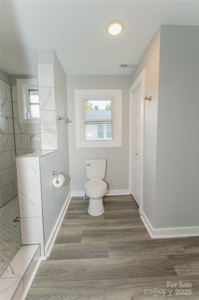 1208 Martin Luther King Ave, Kannapolis, NC 28083 - full bath featuring a walk in shower and wood finished floors