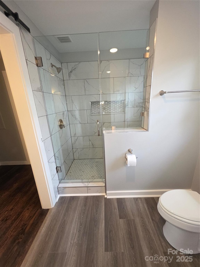 1208 Martin Luther King Ave, Kannapolis, NC 28083 - full bath featuring wood finished floors and a shower stall