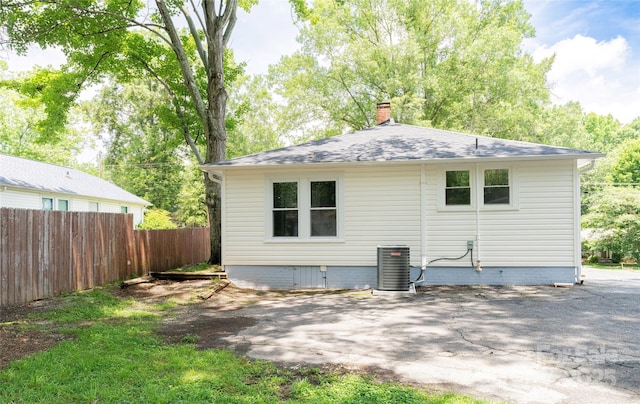 1208 Martin Luther King Ave, Kannapolis, NC 28083 - back of property featuring a chimney, crawl space, and roof with shingles