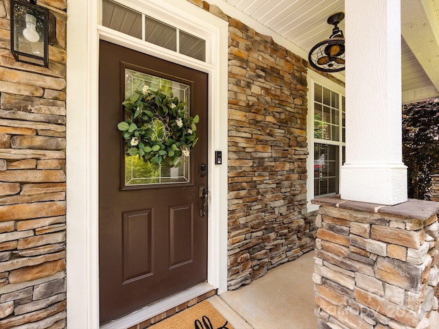 12928 Windy Lea Ln, Huntersville, NC 28078 - view of exterior entry featuring covered porch and stone siding
