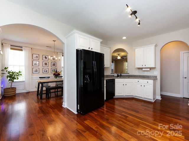 12928 Windy Lea Ln, Huntersville, NC 28078 - kitchen featuring black appliances, arched walkways, a chandelier, white cabinetry, and dark wood-style floors