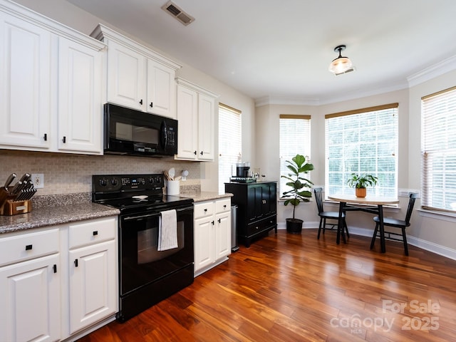 12928 Windy Lea Ln, Huntersville, NC 28078 - kitchen with black appliances, decorative backsplash, white cabinetry, dark wood finished floors, and ornamental molding