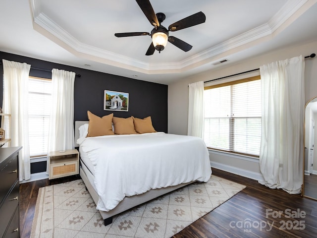 12928 Windy Lea Ln, Huntersville, NC 28078 - bedroom with a tray ceiling, ornamental molding, wood finished floors, a ceiling fan, and arched walkways