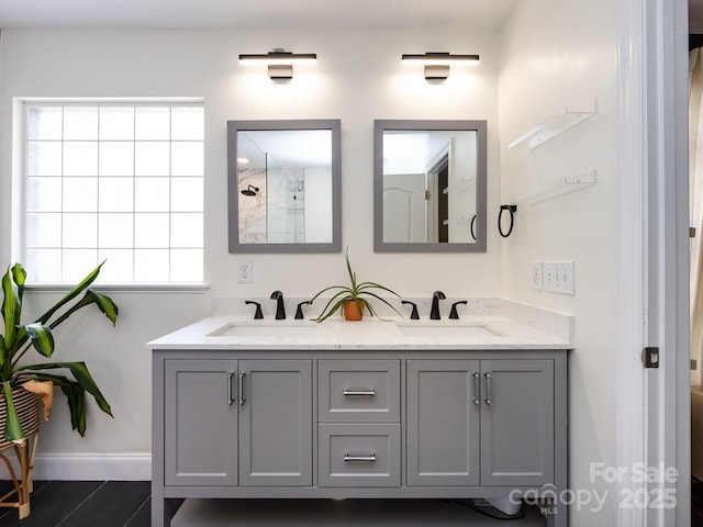 12928 Windy Lea Ln, Huntersville, NC 28078 - bathroom featuring double vanity, a tile shower, and tile patterned floors