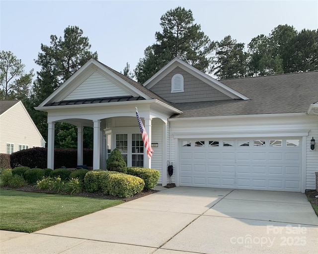 919 Lily Magnolia Ct, Fort Mill, SC 29707 - view of front facade with an attached garage, a standing seam roof, concrete driveway, a front lawn, and a shingled roof