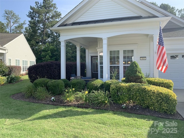 919 Lily Magnolia Ct, Fort Mill, SC 29707 - view of front of property featuring a garage, a front lawn, and covered porch