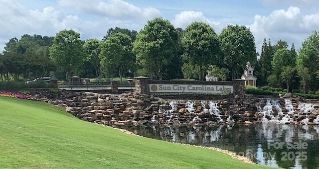 919 Lily Magnolia Ct, Fort Mill, SC 29707 - community sign with golf course view, a water view, and a lawn