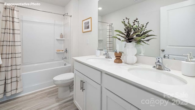 12020 Zazu Way, Charlotte, NC 28215 - full bathroom featuring wood finished floors, double vanity, and shower / bath combo with shower curtain