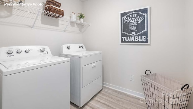 12020 Zazu Way, Charlotte, NC 28215 - laundry room with washer and clothes dryer and light wood-style flooring