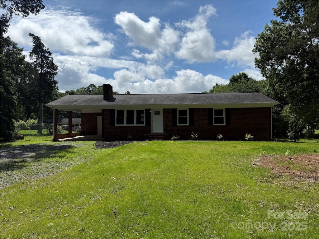 208 Winter St, Richfield, NC 28137 - ranch-style home featuring a front yard, brick siding, a chimney, and entry steps