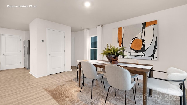 12019 Zazu Way, Charlotte, NC 28215 - dining room with light wood-style flooring and baseboards