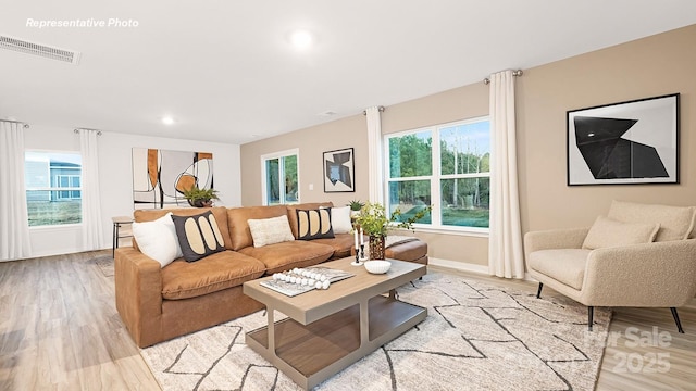 12019 Zazu Way, Charlotte, NC 28215 - living room featuring light wood-type flooring, healthy amount of natural light, and recessed lighting