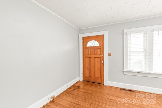 2722 Eastway Dr, Charlotte, NC 28205 - foyer with crown molding, light wood-type flooring, and plenty of natural light