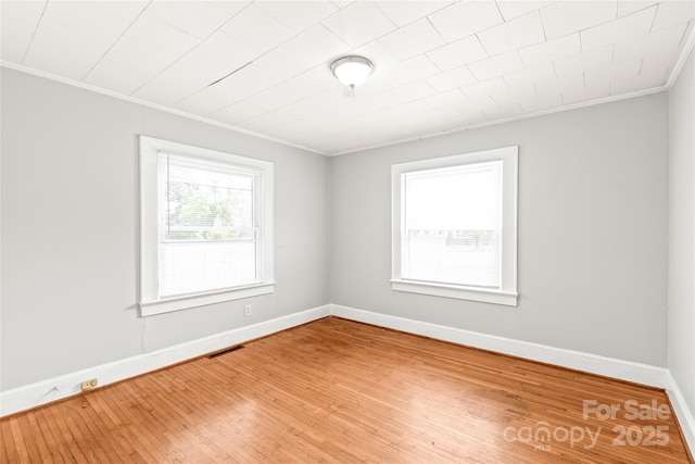 2722 Eastway Dr, Charlotte, NC 28205 - spare room with crown molding and wood finished floors