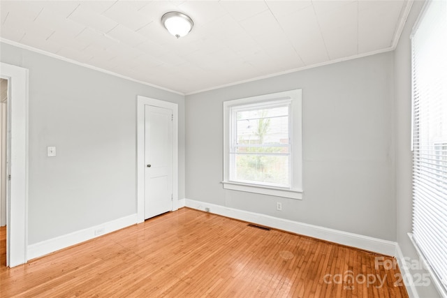 2722 Eastway Dr, Charlotte, NC 28205 - unfurnished bedroom with ornamental molding and light wood-style floors