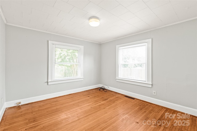 2722 Eastway Dr, Charlotte, NC 28205 - unfurnished room with crown molding and light wood-style floors