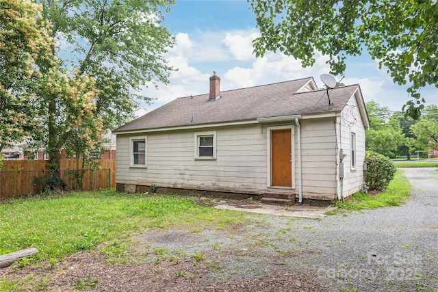 2722 Eastway Dr, Charlotte, NC 28205 - back of house with entry steps, a chimney, and a shingled roof