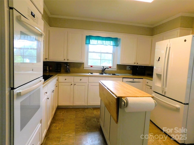 714 Shady Dr, Albemarle, NC 28001 - kitchen with white appliances, healthy amount of natural light, white cabinets, and crown molding