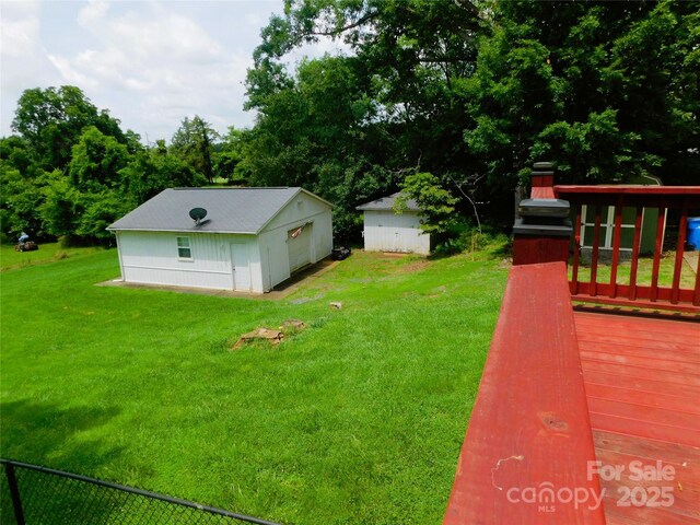714 Shady Dr, Albemarle, NC 28001 - view of green lawn with a detached garage and an outdoor structure