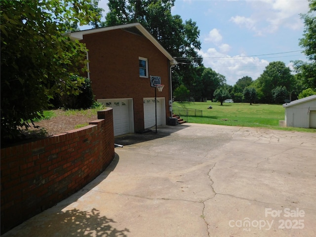 714 Shady Dr, Albemarle, NC 28001 - view of property exterior featuring a garage, a yard, and driveway