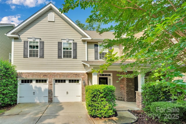 11538 Ardrey Crest Dr, Charlotte, NC 28277 - view of front of home with an attached garage, driveway, stone siding, and a porch