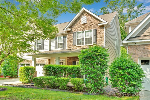 11538 Ardrey Crest Dr, Charlotte, NC 28277 - traditional-style house featuring stone siding and a shingled roof
