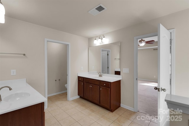 11538 Ardrey Crest Dr, Charlotte, NC 28277 - bathroom with two vanities, tile patterned flooring, and ceiling fan